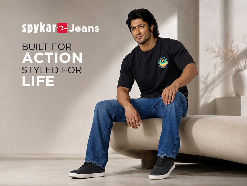 Casual Relaxed-Fit Blue Denim Jeans with a Black Graphic T-Shirt by Spykar