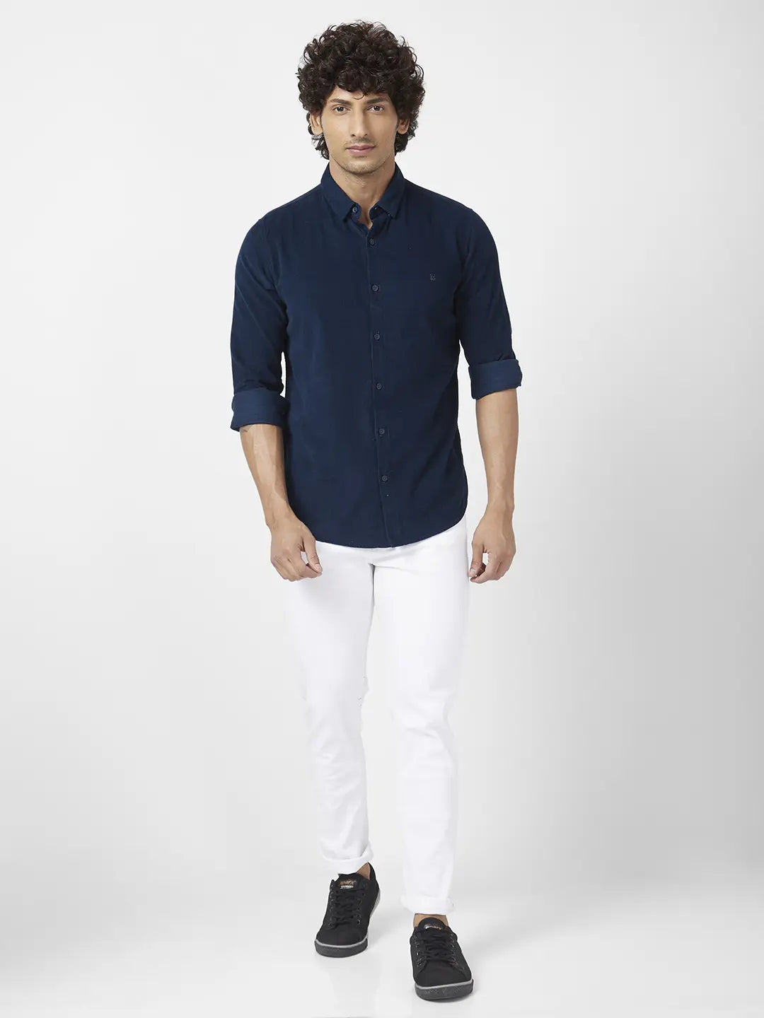 White jeans and navy 2025 blue shirt