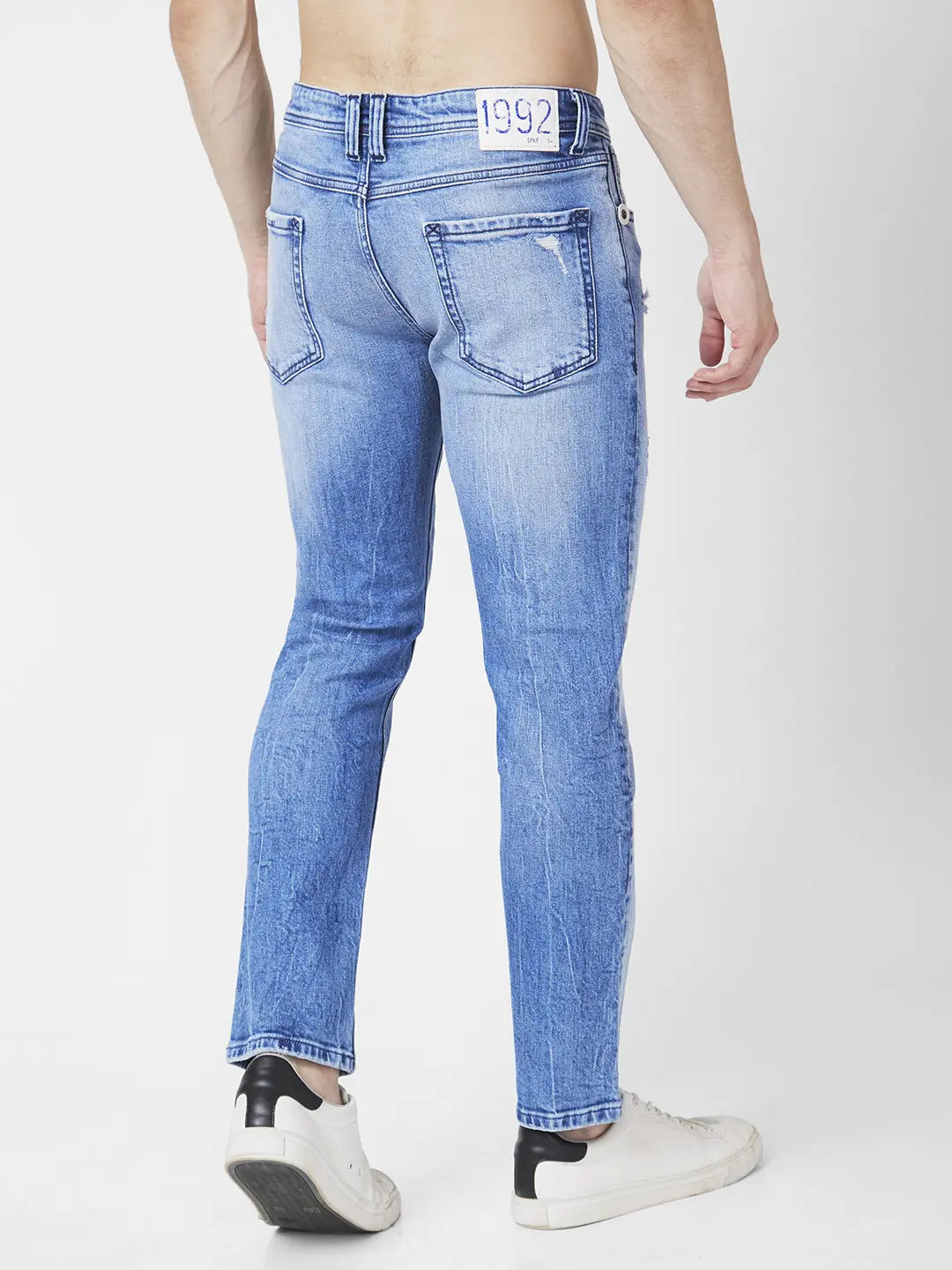 Spykar Men Light Blue Cotton Regular Fit Narrow Length Mild Distressed Mid Rise Jeans (Rover)